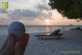 Bürogolf Online beim Sonnenuntergang auf den Malediven
